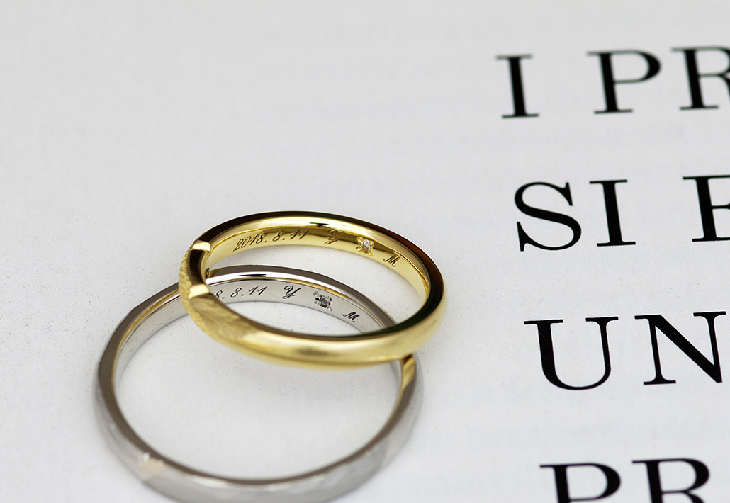 シークレットストーンのペアのダイヤモンドを留めた手作り結婚指輪